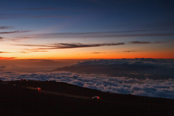 Haleakala Crater at dusk: Haleakala Highway, View of Maui and City lights of Kahului 