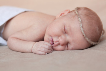 Portrait of cute sleeping newborn girl