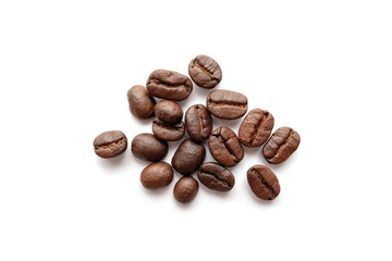 Roasted coffee beans isolated on white background. Close-up.