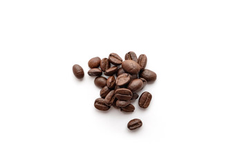 Roasted coffee beans isolated on white background. Close-up.