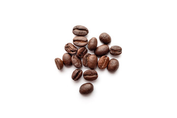 Roasted coffee beans isolated on white background. Close-up.