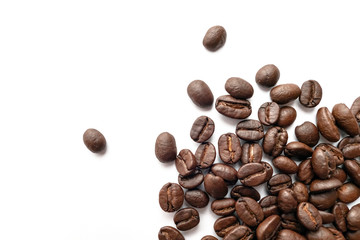 Roasted coffee beans isolated on white background. Close-up.