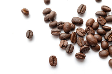 Roasted coffee beans isolated on white background. Close-up.