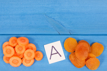 Dried apricot and carrot as source vitamin A, minerals and fiber, copy space for text