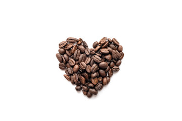 Heart shape of roasted coffee beans isolated on a white background.