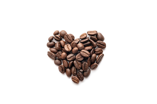 Heart shape of roasted coffee beans isolated on a white background.