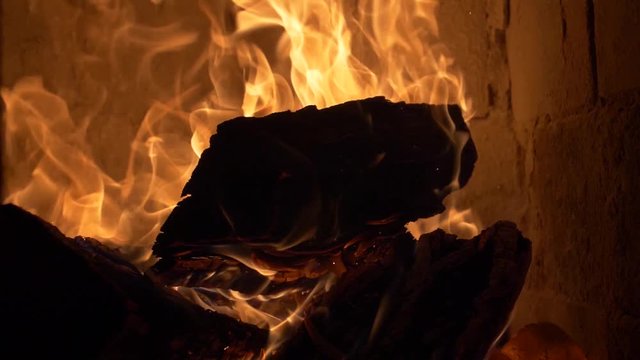 Firewood burning in a tile stove / cockle 180 fps slow motion