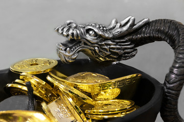 Chinese silver dragon ornament with ancient gold shiny coins