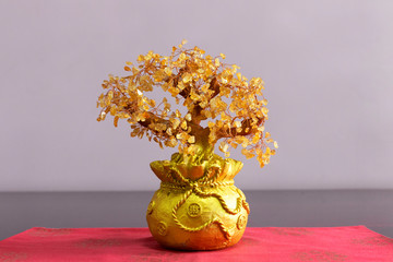 Auspicious chinese decorative plant with gold coated over