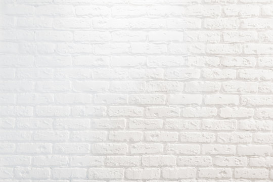 White painted brick wall in a modern loft apartment. Background texture