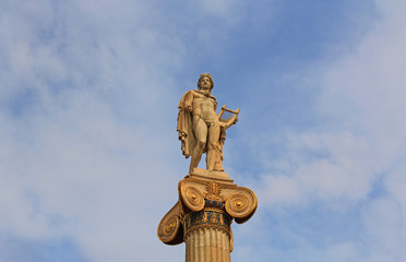Apollo statue at the National Academy of Arts in Athens, Greece with blue sky copy space.