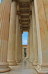 The tall columns on the entrance porch of the National Academy of Arts in Athens, Greece.
