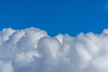 Naklejka na ściany i meble Cumulus Cloudscape with a Blue Sky