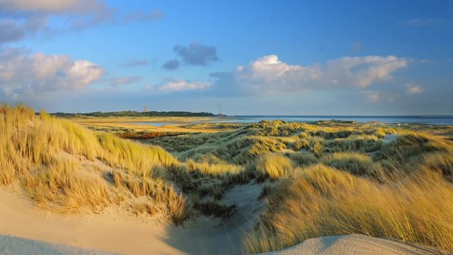 NorthSea shipping traffic control center in lighthouse of Terschelling island with bird sanctuary in foreground.