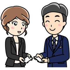 男性女性会社員-笑顔で名刺交換