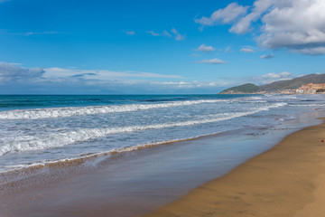Waves Washing up on the Beach on the Southern Italian Mediterranean Coast on a Sunny Day