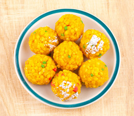 Laddu also know as laddoo, ladoo, laddo are ball-shaped sweets popular in the Indian festivals. Laddu are made of flour, minced dough and sugar with other ingredients.
