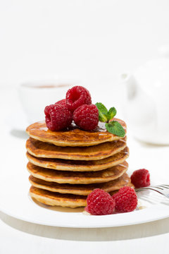 stack of pancakes with raspberries for breakfast, vertical