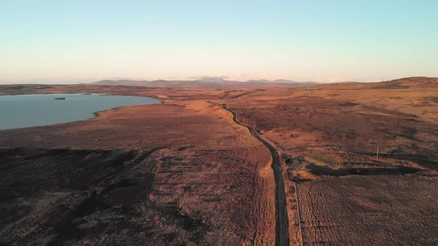 Aerial Drone flight over Loch Gorm located on the Isle of Islay, Hebrides, Scotland next to the Kilchoman Rockside Farm Whisky Distillery.