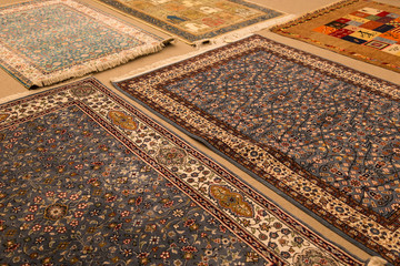 The carpets on the background in the shop for special costumers from Nevsehir, Sivas and other Turkish city in Turkey.