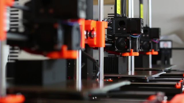 RACK FOCUS: 3D Printers At Work In A Lab.