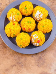 Laddu also know as laddoo, ladoo, laddo are ball-shaped sweets popular in the Indian festivals. Laddu are made of flour, minced dough and sugar with other ingredients.
