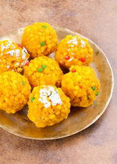 Laddu also know as laddoo, ladoo, laddo are ball-shaped sweets popular in the Indian festivals. Laddu are made of flour, minced dough and sugar with other ingredients.