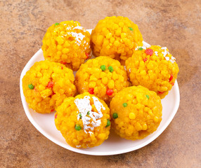 Laddu also know as laddoo, ladoo, laddo are ball-shaped sweets popular in the Indian festivals. Laddu are made of flour, minced dough and sugar with other ingredients.