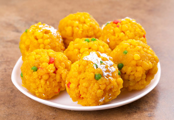 Laddu also know as laddoo, ladoo, laddo are ball-shaped sweets popular in the Indian festivals. Laddu are made of flour, minced dough and sugar with other ingredients.
