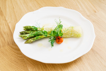 grilled asparagus on the white plate