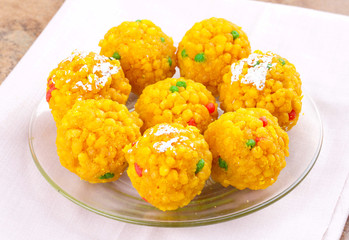 Laddu also know as laddoo, ladoo, laddo are ball-shaped sweets popular in the Indian festivals. Laddu are made of flour, minced dough and sugar with other ingredients.