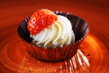 pastry with whipped cream and strawberry