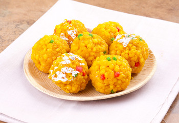 Laddu also know as laddoo, ladoo, laddo are ball-shaped sweets popular in the Indian festivals. Laddu are made of flour, minced dough and sugar with other ingredients.
