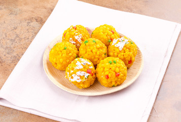 Laddu also know as laddoo, ladoo, laddo are ball-shaped sweets popular in the Indian festivals. Laddu are made of flour, minced dough and sugar with other ingredients.