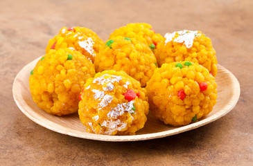 Laddu also know as laddoo, ladoo, laddo are ball-shaped sweets popular in the Indian festivals. Laddu are made of flour, minced dough and sugar with other ingredients.