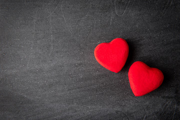 Red hearts on black background.