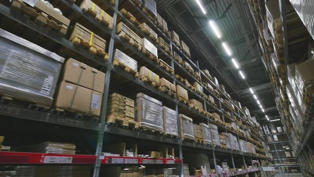 Interior of a multi-level warehouse. Steadicam shot