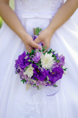 Obraz na płótnie Canvas Beautiful wedding bouquet in hands of the bride. Wedding concept
