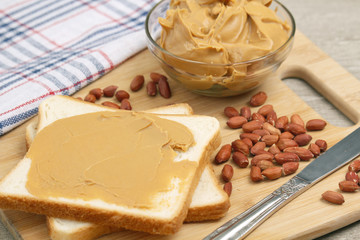Sandwiches with peanut butter and peanuts