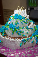 Big white and blue wedding cake. Cake with a beautiful decor. Signed on the cake: 