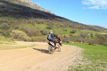 Fototapeta premium Motorcyclists on mountain serpentine. The mountains. Motorsport