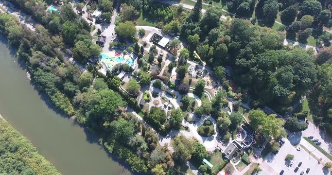 Aerial Amusement Park Daytime By River And Lots Of Trees 002