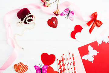 Flat lay red and white layout for Woman's or Valentine's Day with decoration