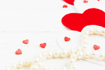 Pearls and hearts on wooden background, Valentine's Day
