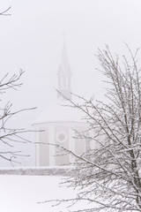 Winter Switzerland fairytale chapel on hill 