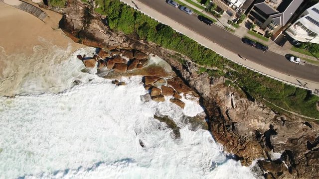 Aerial of waves in Bronte Beach, Sydney, New South Wales, Australia, Pacific