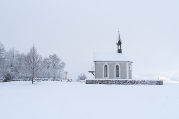Winter Switzerland fairytale chapel on hill 