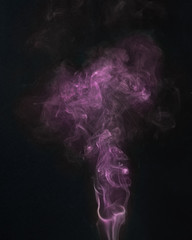 Fototapeta premium purple smoke on a black backround