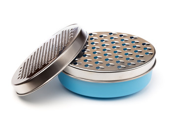 bowl with food grater isolated on white.