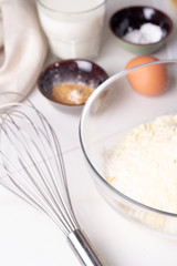 Fototapeta na wymiar ingredients for baking flour, eggs, mloko on a white background.